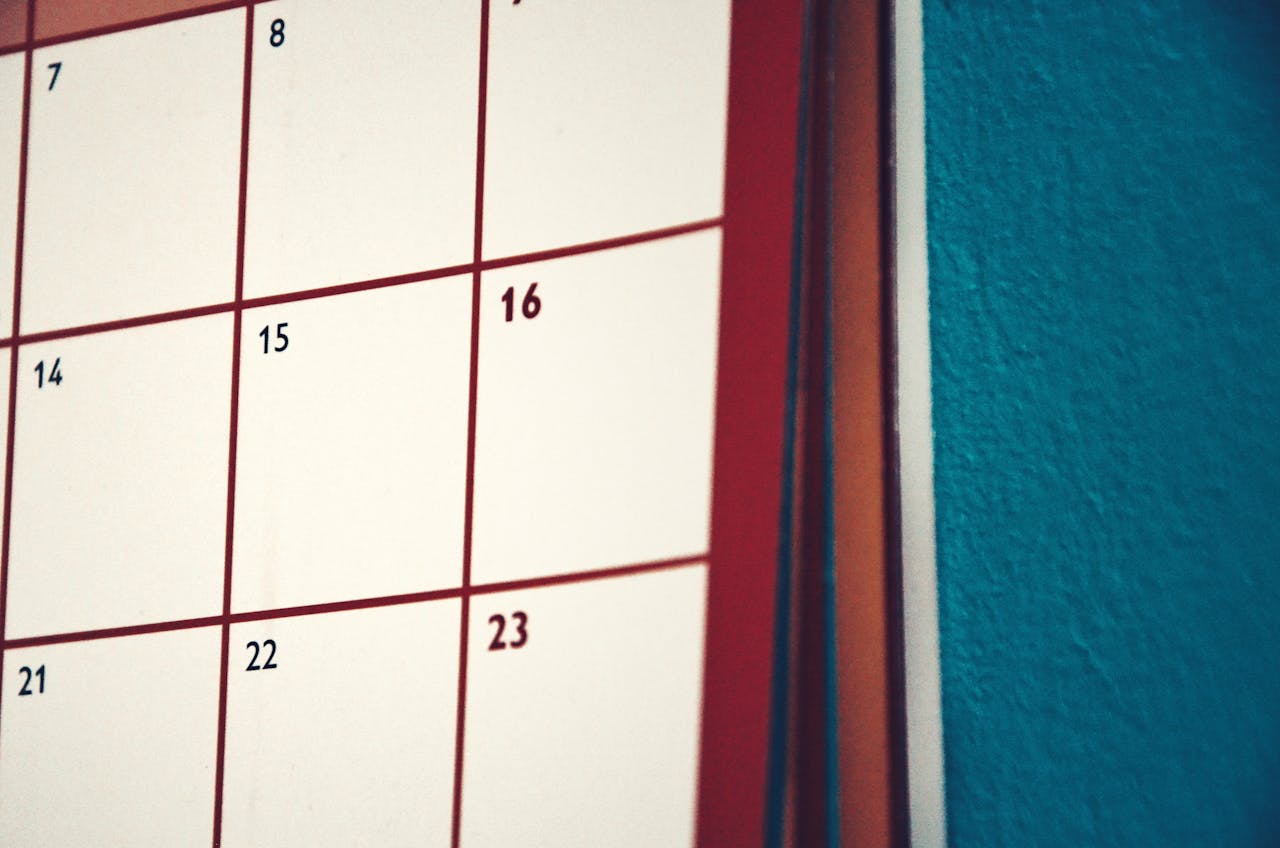 why-choose-us A minimalist calendar hanging on a colorful wall, perfect for planning and organization.